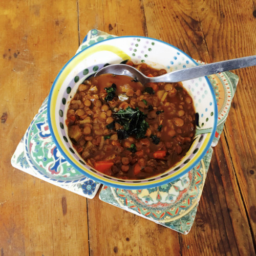 Lentil Soup topped with Crispy Kale