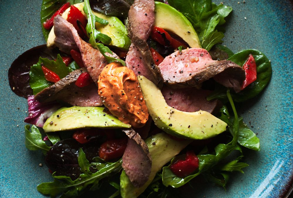 Mixed green salad with steak and paprika aioli