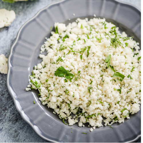 Kale and cauliflower couscous with baked salmon